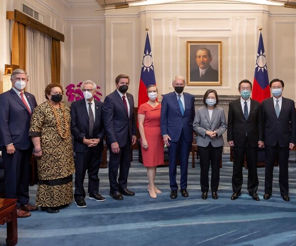 taiwan officials pose with u.s. congress members for a photo