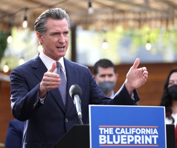 gavin newsom speaks at a bill signing ceremony