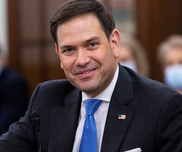 marco rubio smiles in hearing