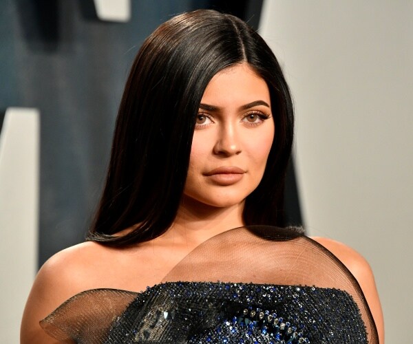 kylie jenner in a black sparkly dress and straight black hair