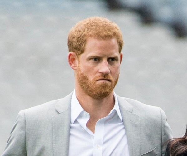 Prince Harry looks on