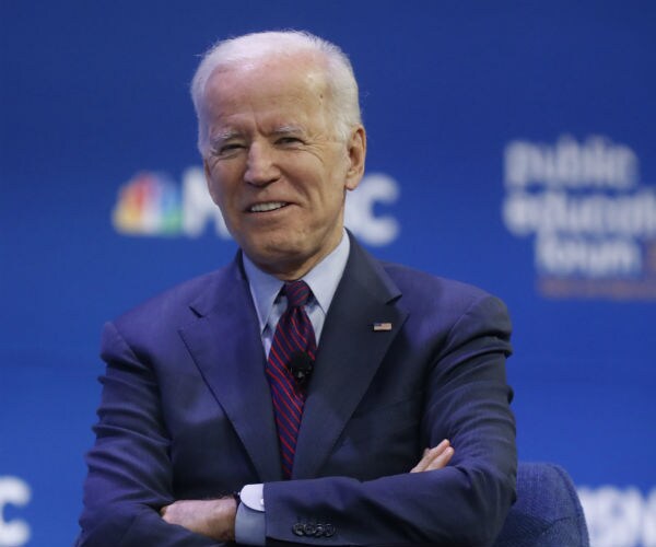 Former Vice President Joe Biden is shown in a blue suit, dress shirt and tie