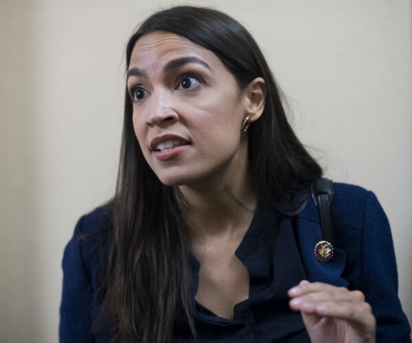 aoc is shown after a meeting of the house democratic caucus