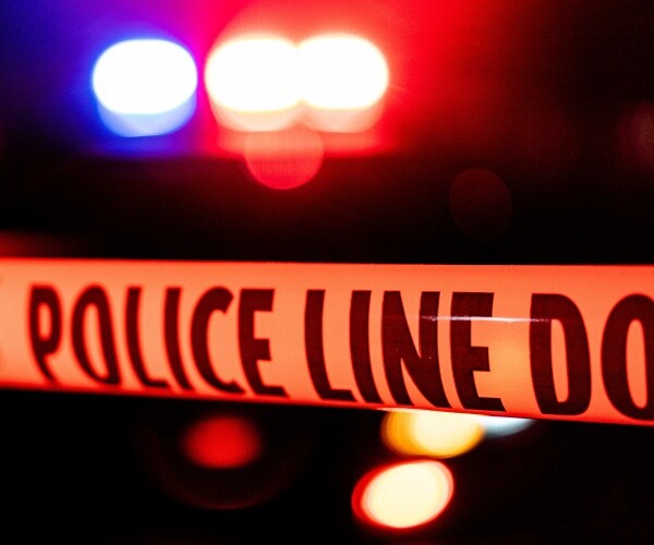 police line blocks off a crime scene