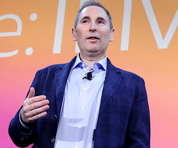 andy jassy speaks during a conference