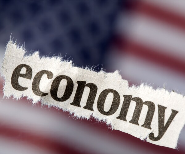 the word economy with an american flag in the background