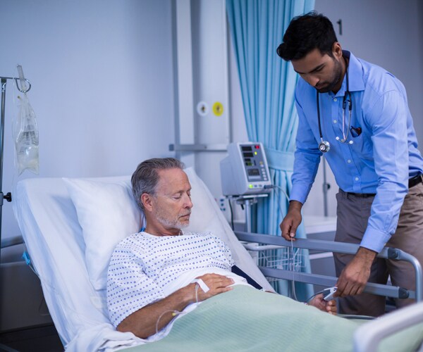 a doctor and patient in a hospital room