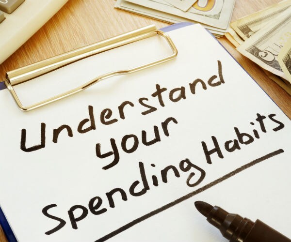 graphic shows the words understand your spending habits on a clip board