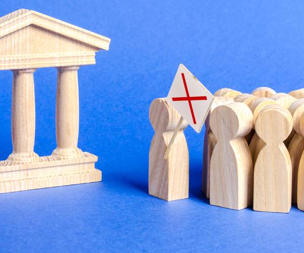 wooden block people protesting