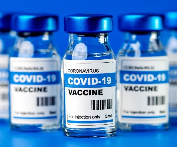 vials lined up labeled "covid-19 vaccine"