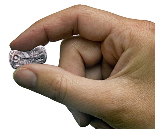 right hand pinching a chinese yuan on white background. 