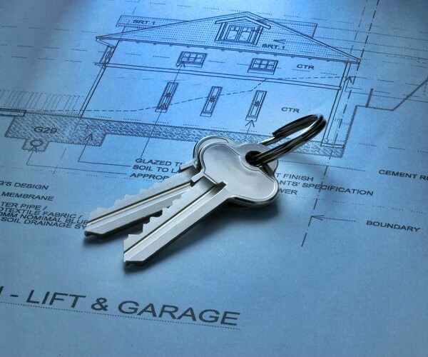 House keys on top of house plans or blueprints