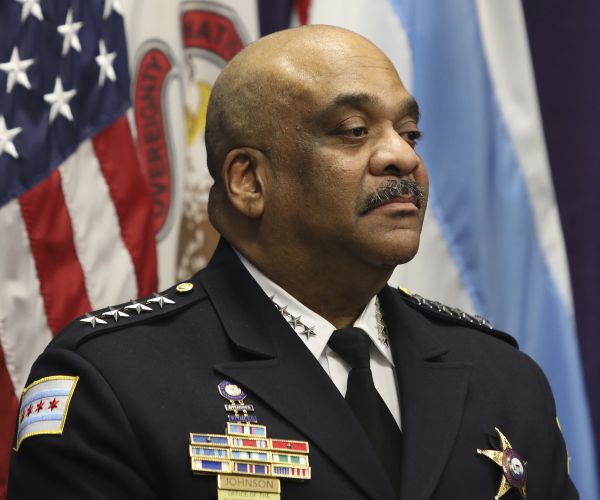 eddie johnson stands contrite before a news conference