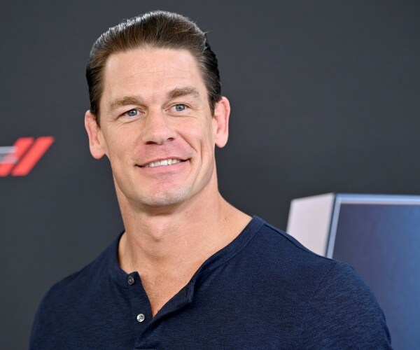 john cena poses for a phoeo