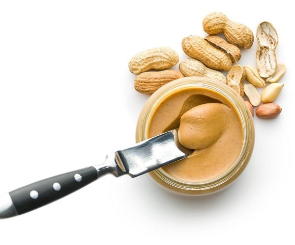 peanut butter in jar, knife