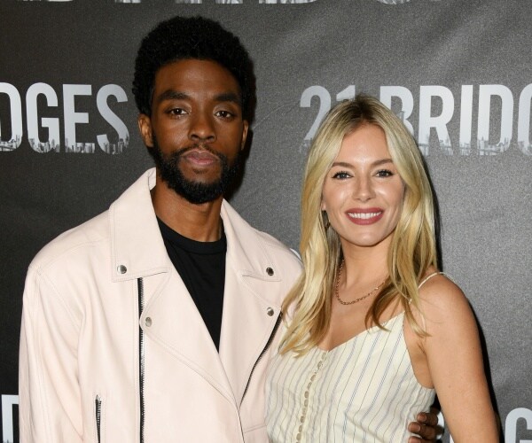 chadwick boseman and sienna miller attend photocall