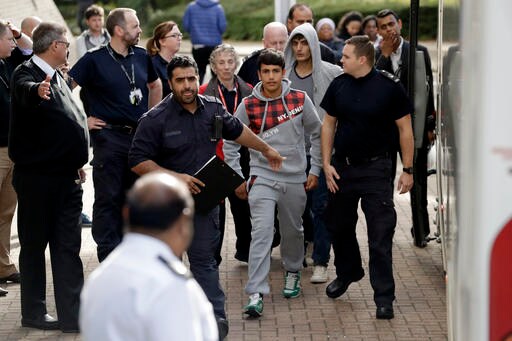 The Latest: Camerawoman Who Kicked Migrants Takes Film Award