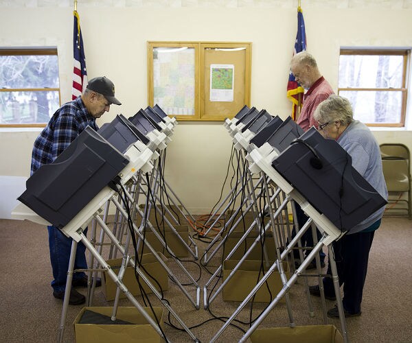 people voting at a polling place
