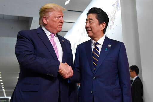 The Latest: Trump Kicks off G-20 Trip with Meeting with Abe