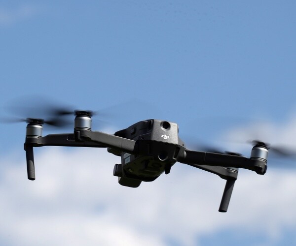 gray and black drone in the sky