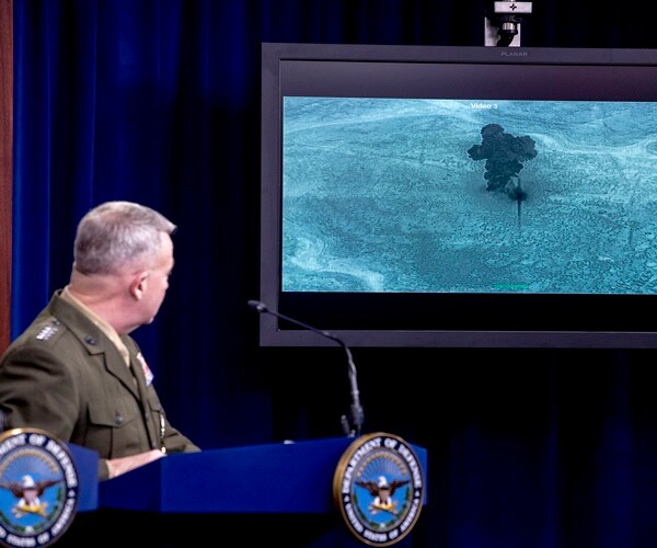 U.S. Central Command Commander Marine Gen. Kenneth McKenzie speaks, showing a video