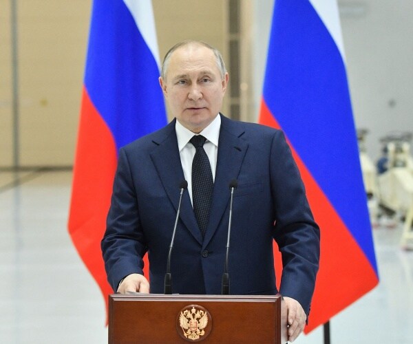 vladimir putin delivers a speech