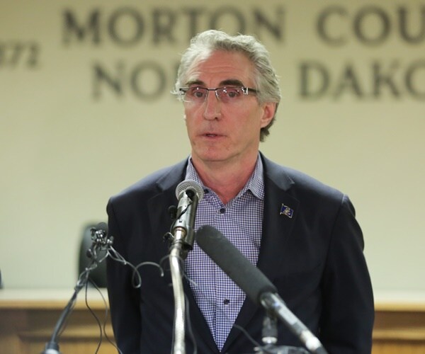 gov. doug burgum addresses reporters