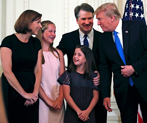 Brett Kavanaugh and his family share a moment with President Donald Trump at his nomination ceremony