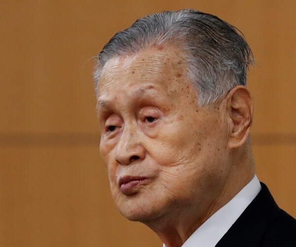 yoshiro mori in a black suit and white dress shirt 