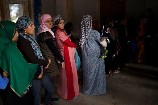 The Latest: Starbuck Plans to Hire 2,500 Refugees in Europe