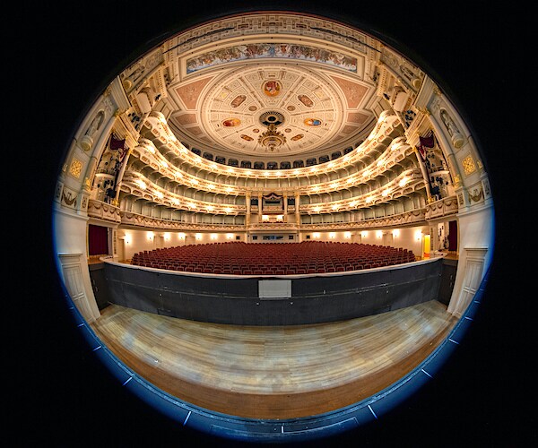 a key hole look at an empty auditorium