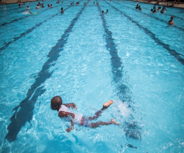 kids swimming in a pool