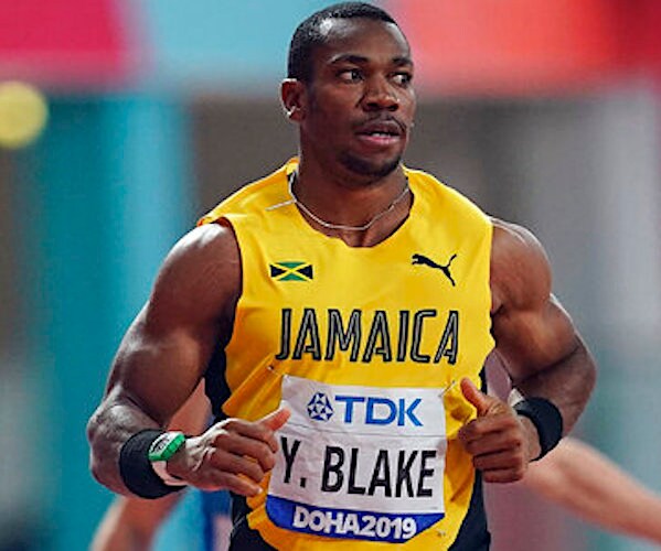 yohan blake looks up as he finishes his 200 meter heat