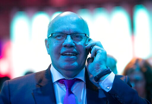 German Economy Minister Falls Leaving Stage at IT Event