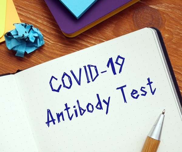 a notebook says covid-19 antibody test