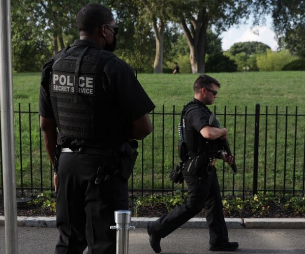 secret service officers standing outside
