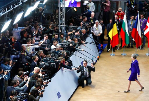 The Latest: Merkel: We Didn't Dwell on No-deal Brexit