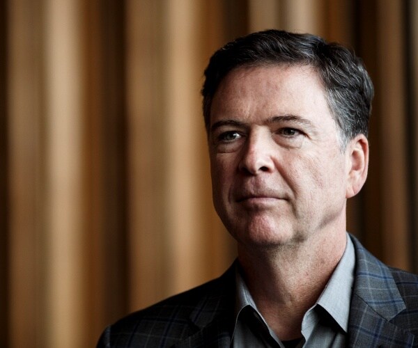comey in a plaid gray suit and gray shirt