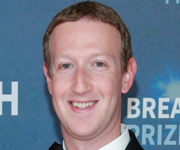 A smiling Mark Zuckerberg is shown.