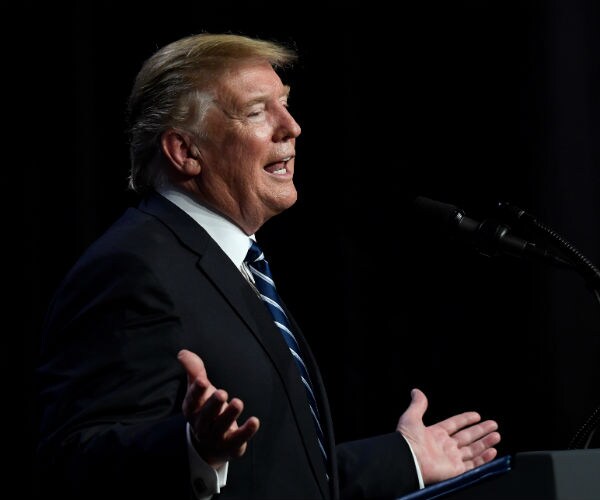 president donald Trump speaking during a news conference in hanoi