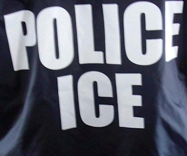 a jacket back reads police ice