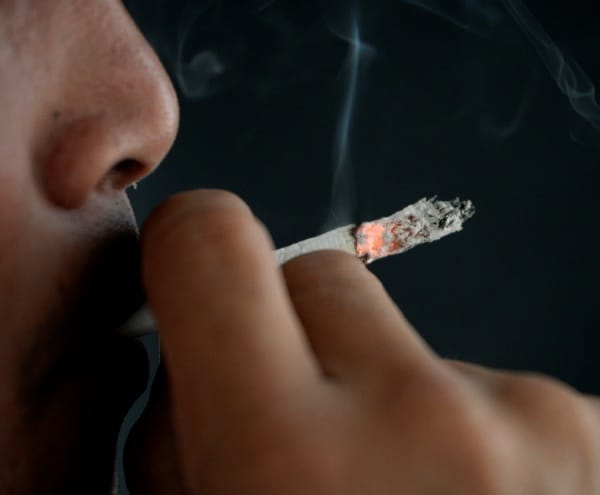 person smoking a cigarette