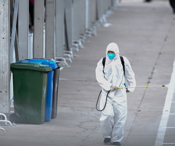 a worker in beijing sprays disinfectant