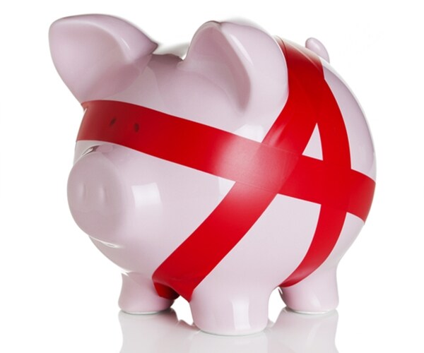 pink piggy bank tied up in red tape