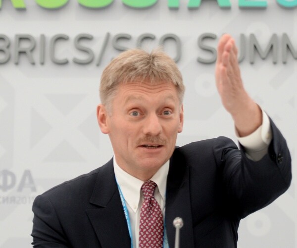 dmitry peskov gestures while speaking