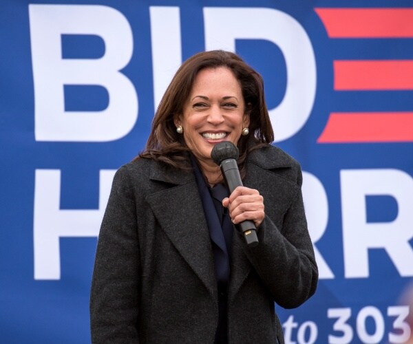 kamala harris smiles onstage