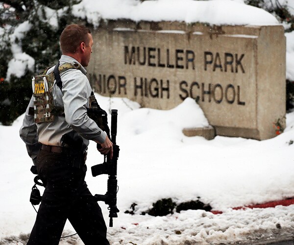 Parents Disarm Son in School Hallway After He Fires Shot