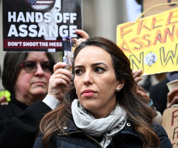 Stella Moris addresses the media