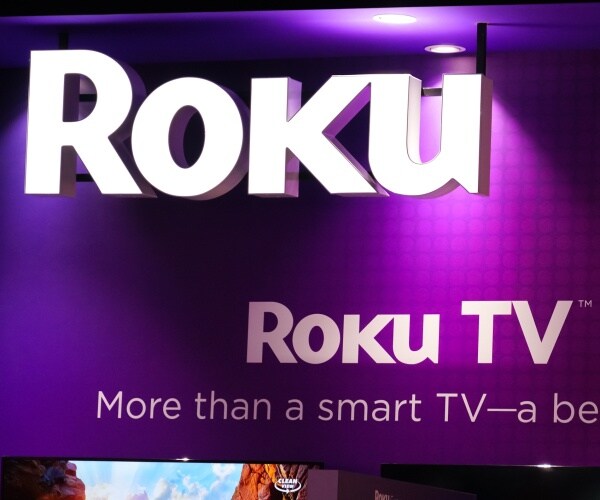 roku logo is shown at a display of tvs