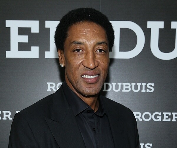 scottie pippen stands on red carpet